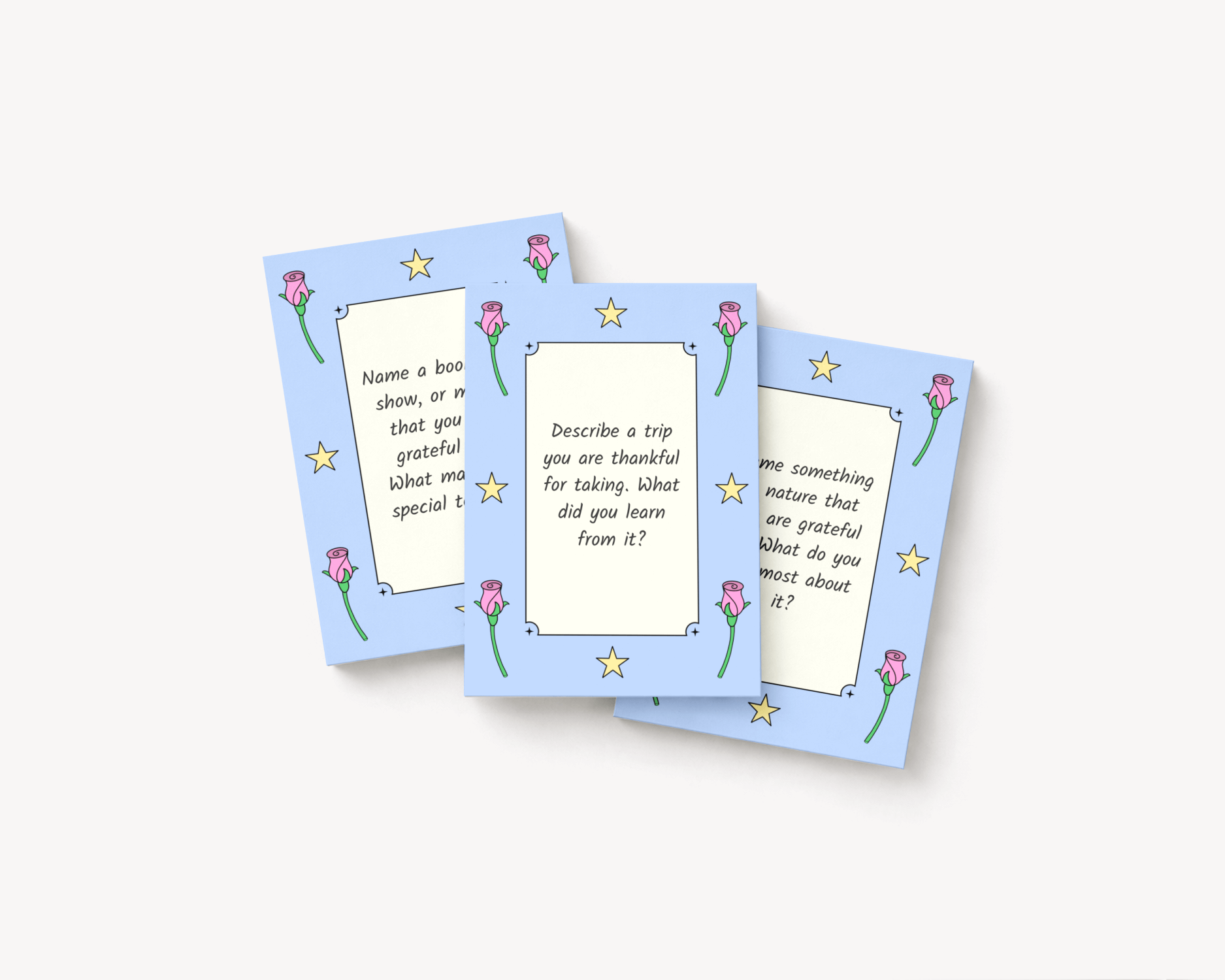 Gratitude journaling cards with hand-drawn motifs of rose buds and stars